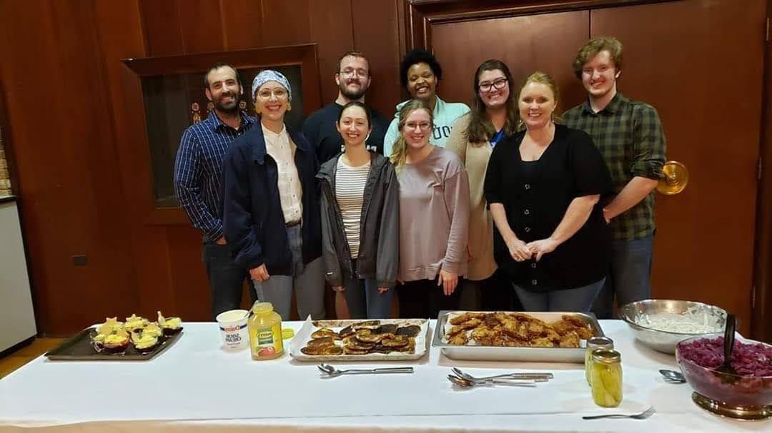 Jewish and Holocaust Studies students in front of class with food prepared