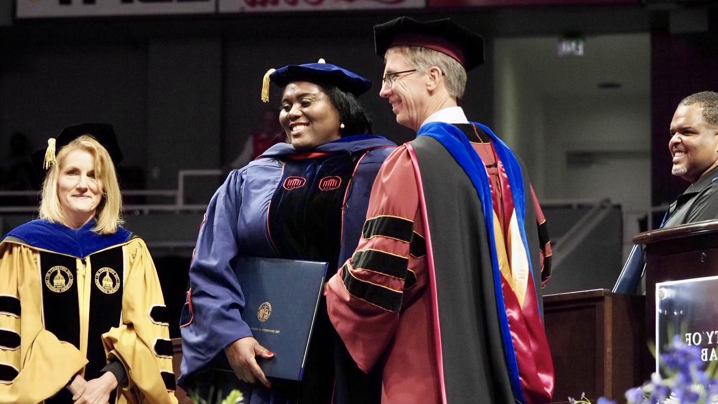 Dr. Lucas receiving her diploma