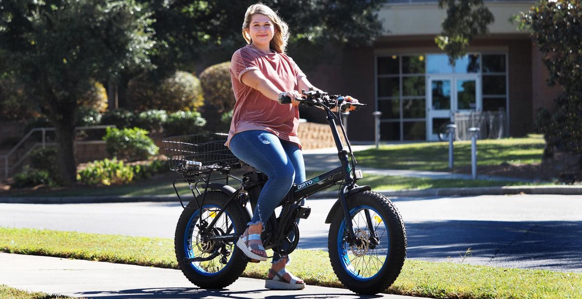 At the University of South Alabama, where she is a freshman, Claudia Allday is studying nursing and travels campus on an electric bicycle.